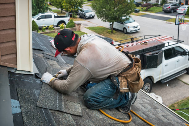 Professional Roofing technician working in Rogers, ND